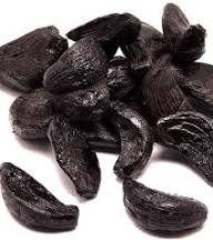 Peeled Black Garlic by dates and roots